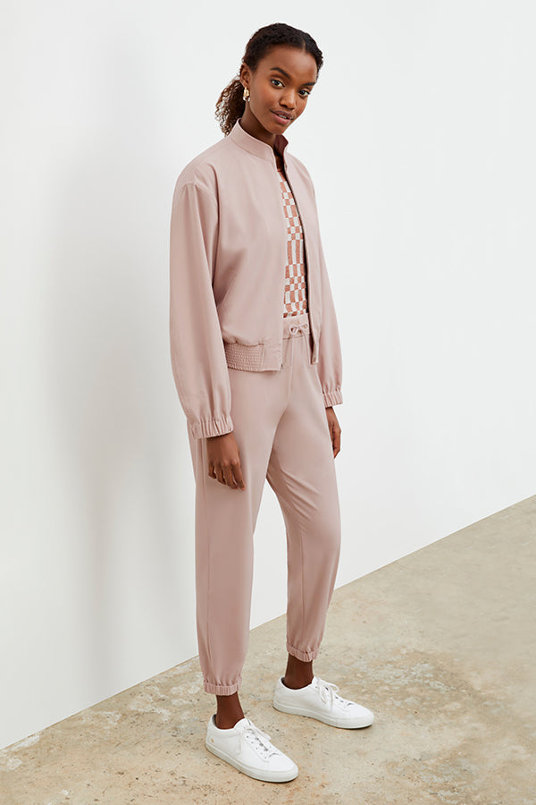 Front image of a woman wearing the Delaney jogger in Blush | Exclude | Grid Hover