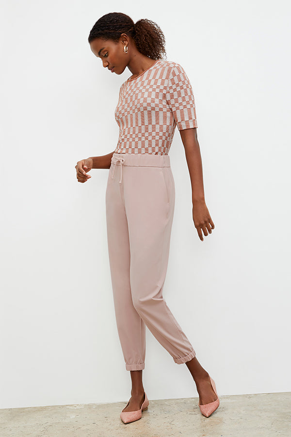 Front image of a woman wearing the Delaney jogger in Blush | Exclude | Grid