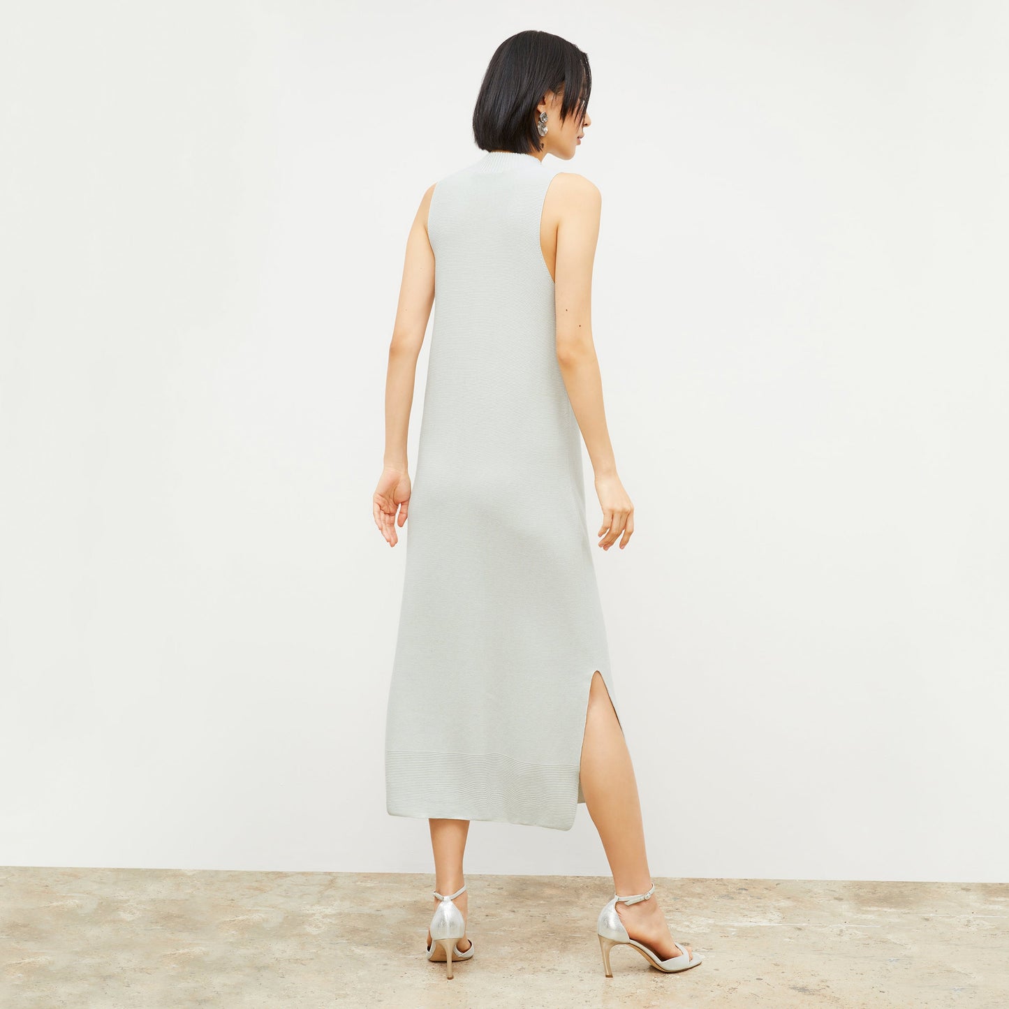 Back image of a woman wearing the Felda dress in Air