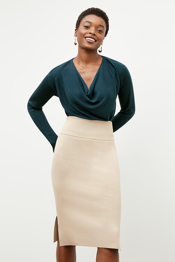 Front image of a woman standing wearing the Harlem skirt in latte | Exclude | Grid