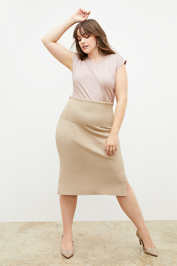 Front image of a woman standing wearing the Harlem skirt in latte | Grid Hover | Exclude