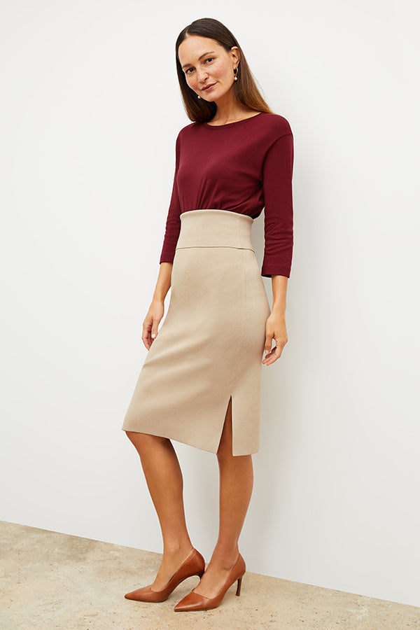 Front image of a woman standing wearing the Harlem skirt in latte | Exclude