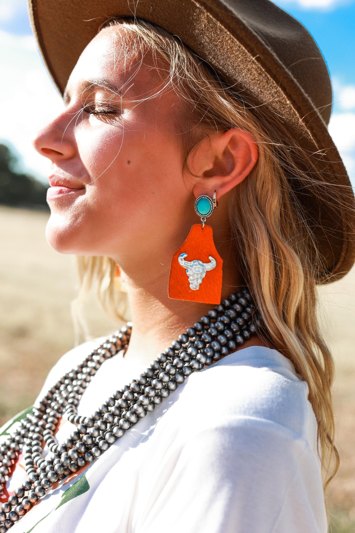 Take A Number Orange Cowhide Copper Cow Skull Stud Earrings