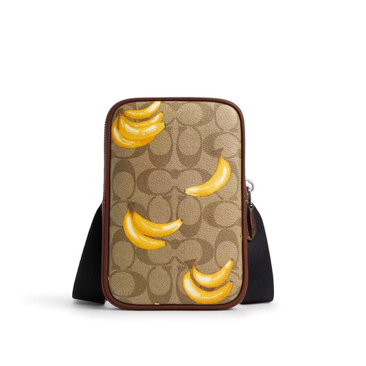 title:Coach Men's Aden Crossbody In Signature Canvas With Banana Print;color:Khaki / Dark Saddle